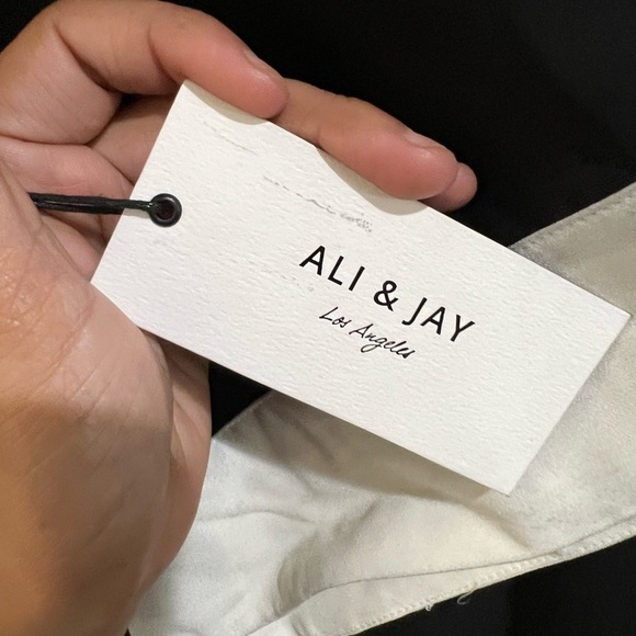 ALI & JAY Elegant Black Dress with White Accents - Picture 7 of 10